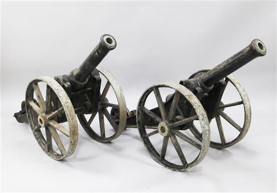 A pair of iron field cannons, overall length 3ft 9in.